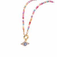 Perlenkette Choker pastell/goldfarben + Evil Eye Messing...